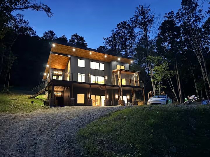 The Overlook cabin illuminated at dusk in Hocking Hills